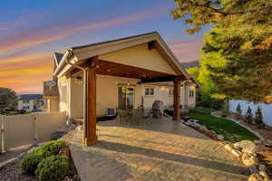 Back of property featuring a fenced backyard, a patio area.