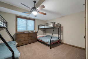Bedroom featuring visible vents, ceiling fan, and light colored carpet