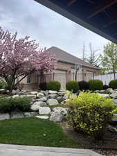 View of yard with fence and an attached garage