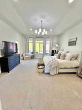 Bedroom featuring recessed lighting, a notable chandelier, and carpet