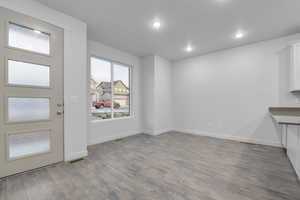 Entryway with visible vents, recessed lighting, baseboards, and wood finished floors