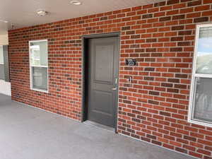 Property entrance with brick siding