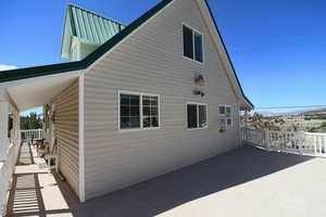 View of side of property with a mountain view