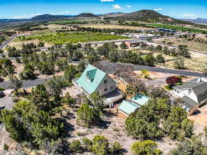 Birds eye view of property with a mountain view and a rural view