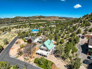 Birds eye view of property with a mountain view