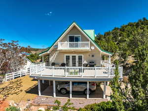 featuring a deck, french doors, and a balcony