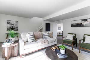Living area featuring new flooring & paint