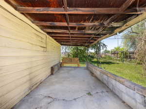 View of patio with a carport