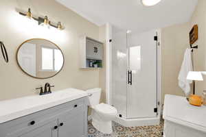 Primary bathroom recently remodeled with new shower, cute tile flooring.