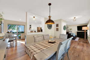 Dining room with view to family room and sliding door to backyard.