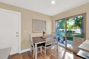 Kitchen table dining area with door to shady patio.