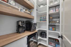 Pantry featuring wine cooler