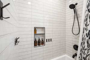 Full bathroom featuring shower / tub combo with curtain