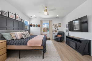 Bedroom with recessed lighting, a ceiling fan, and light wood-style flooring