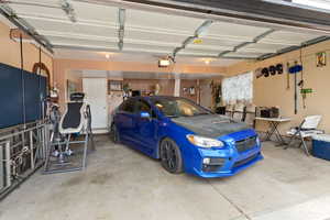 Garage featuring a garage door opener