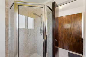 Full bathroom featuring a stall shower