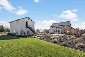 View of yard featuring a pergola, a vegetable garden, and stairway