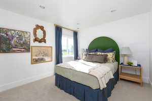 Bedroom featuring recessed lighting, baseboards, and light colored carpet