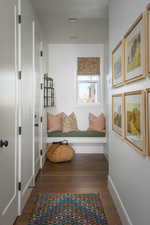 Mudroom with baseboards and wood finished floors