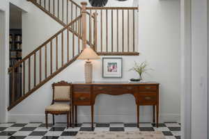 Stairs featuring tile patterned floors and baseboards