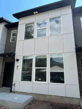 View of side of property featuring brick siding