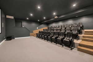 Home theater room featuring recessed lighting, baseboards, and visible vents