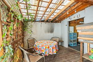 Covered Deck Leading into Shed/Gym Space With Power.
