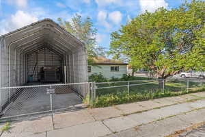 Large Covered RV Pad With Electricity on South West Side of Home.