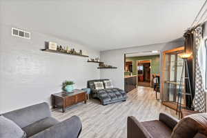 Front Room With Updated Flooring.