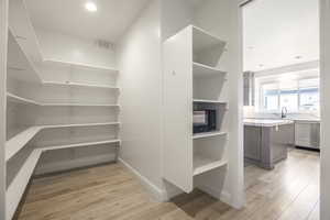 Pantry featuring a sink