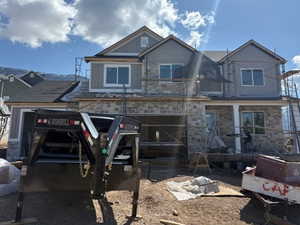 Unfinished property featuring stone siding