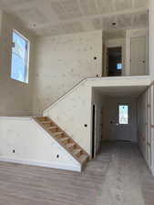 Stairs featuring wood finished floors