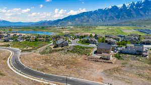 Aerial view featuring a residential view and a water and mountain view