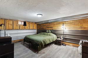 Family Room used as suite with wood walls and industrial siding