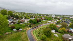 View of the 20 mile paved Murdock Canal Trail directly behind the home, as well as the surrounding community