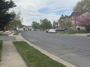 View of road featuring a residential view, sidewalks, and curbs
