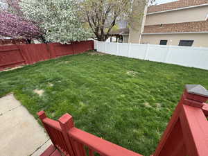 View of yard with a fenced backyard