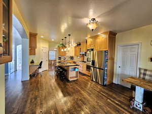Kitchen looking straight ahead at formal dining room with pantry and desk on left