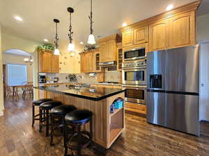 Kitchen with archway leading to formal dining room