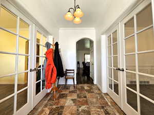 Entry featuring dual French doors