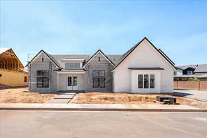 Modern farmhouse style home featuring a standing seam roof and a metal roof