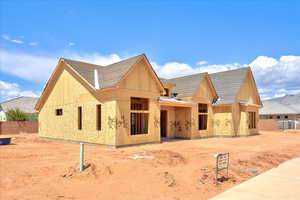View of front of house featuring fence