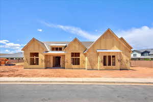View of front facade featuring fence