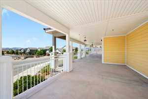 View of patio with a residential view and a balcony