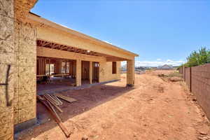 View of yard with fence and a patio area