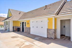 View of property exterior with brick siding