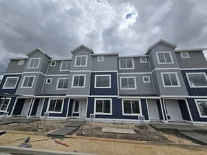 Townhome / multi-family property featuring board and batten siding