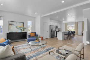 Living room featuring recessed lighting and light wood-type flooring