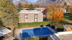 View of swimming pool featuring a mountain view and a patio