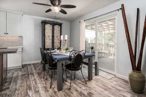 Dining room with baseboards, and a ceiling fan